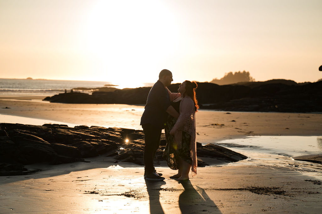 Couple kissing on the beach in Tofino BC