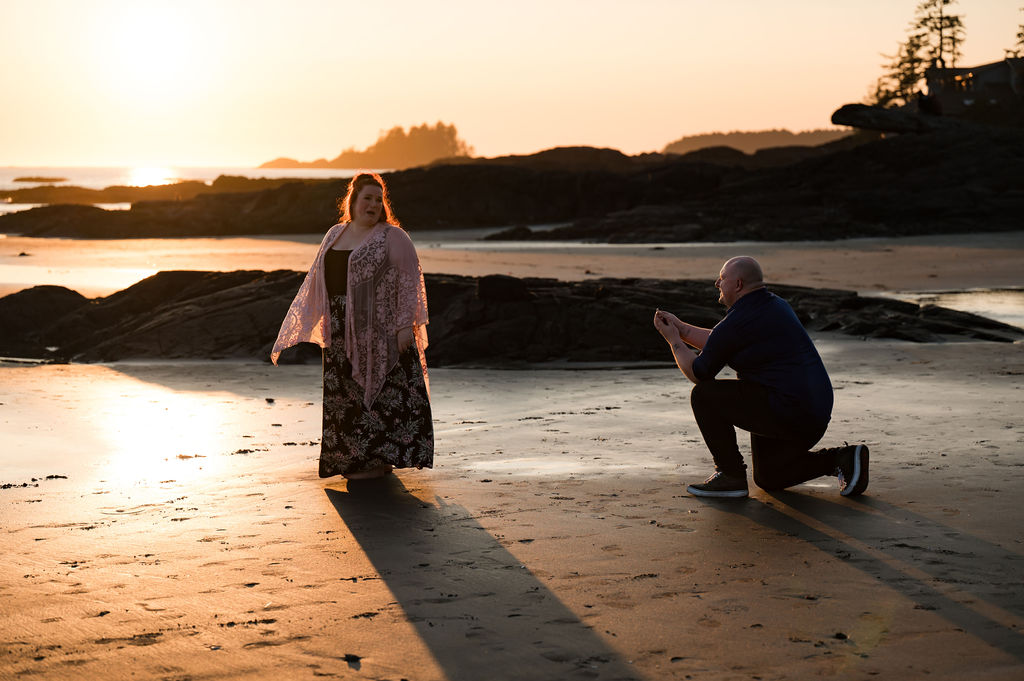 Man proposes on the beach in Tofino BC